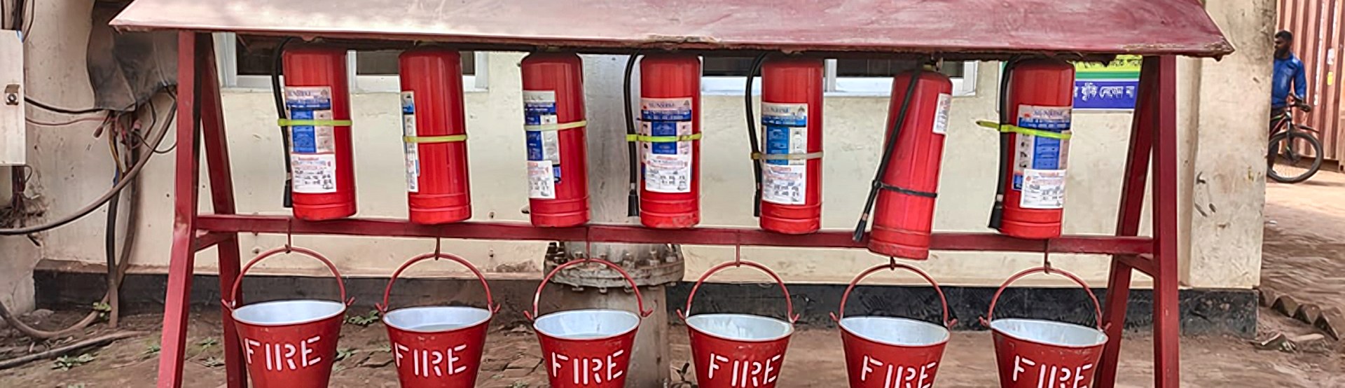 Fire extinguishers and fire buckets on a rack at the CCTCL depot